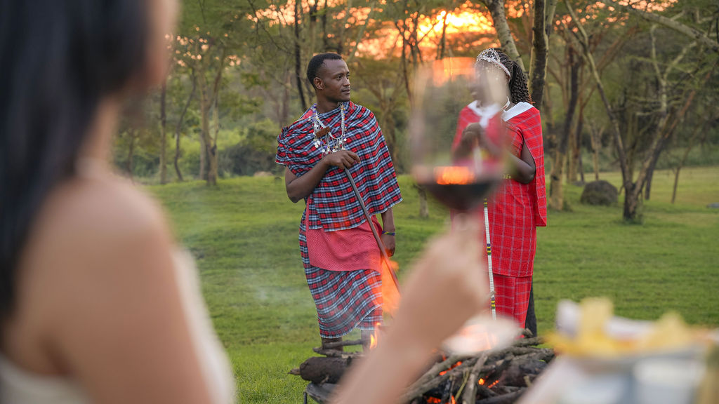 Guests enjoying a bush dinner at Giraffe Manor Tanzania
