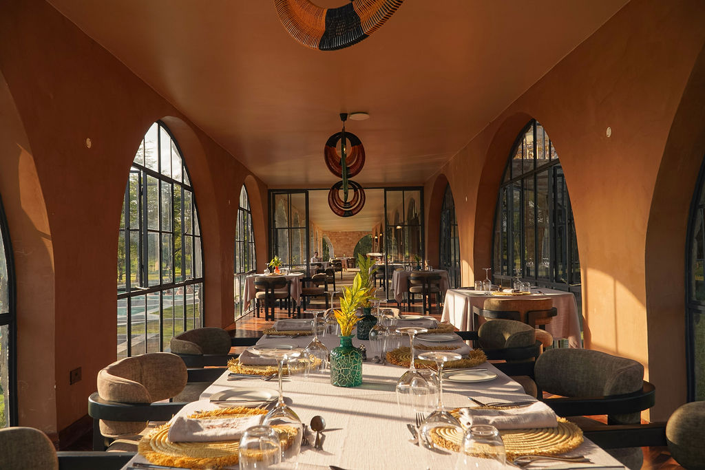 Dining under the arched windows at Giraffe Manor Tanzania