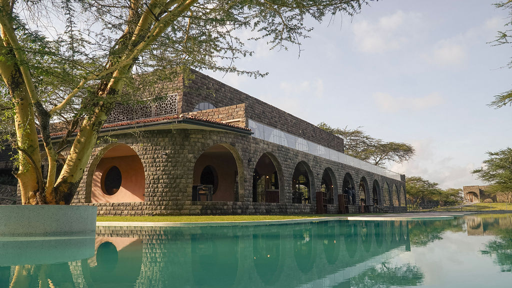 Pool and stone arcade at Giraffe Manor Tanzania