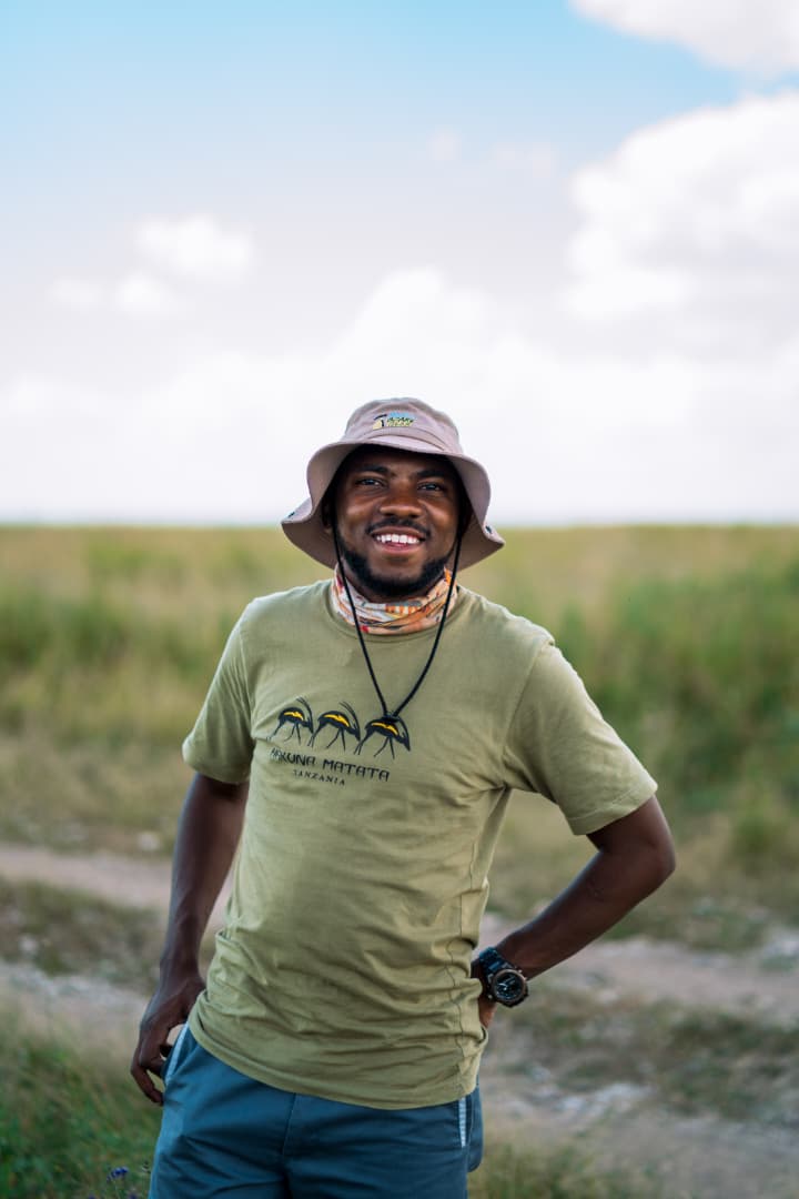 Portrait of a safari guide standing in the open plains