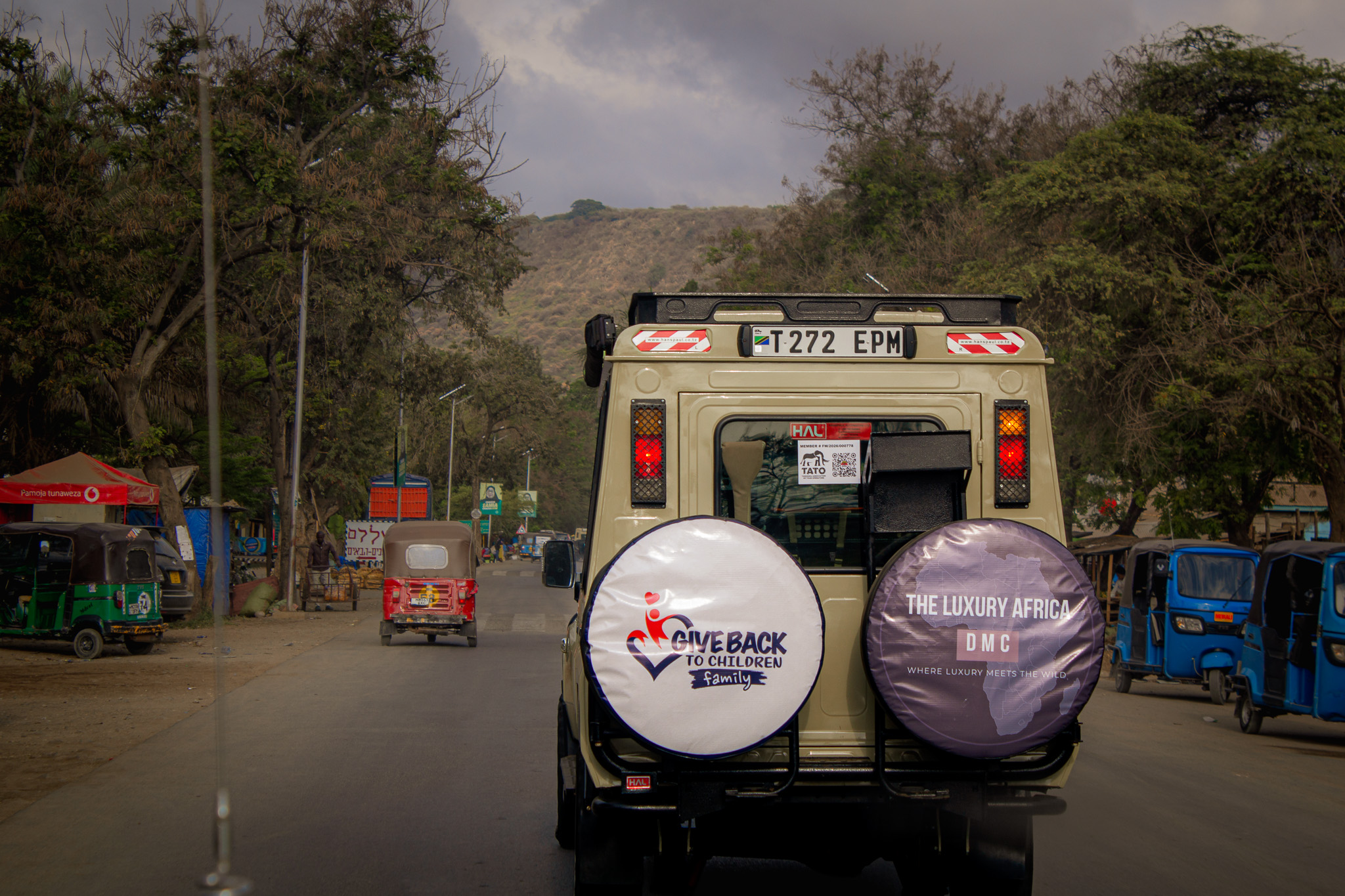 Luxury Africa DMC safari vehicle on the road in Tanzania
